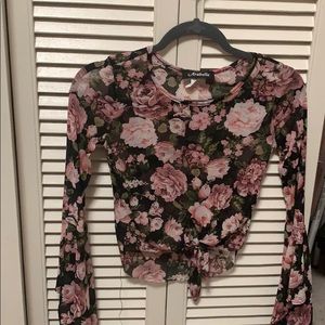 A mesh top with flower details.